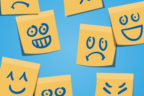 variety of emotions depicted in faces drawn onto postit notes