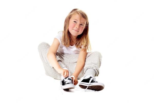 Example child trying to tie her shoelaces, something children with Developmental Coordination Disorder can struggle with