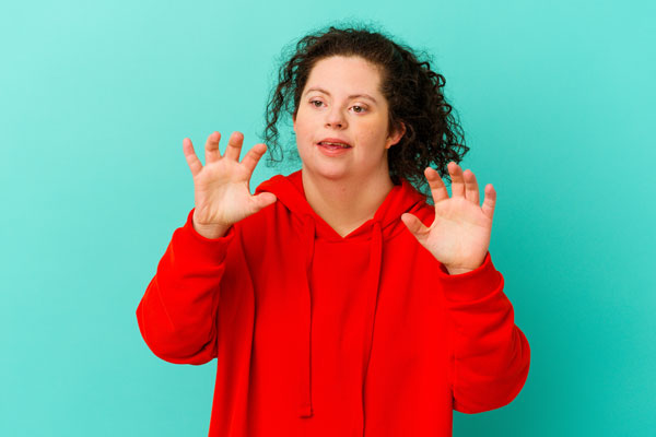 teenage girl with rett syndrome showing unusual hand movements