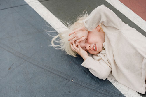 Small child lying on the ground