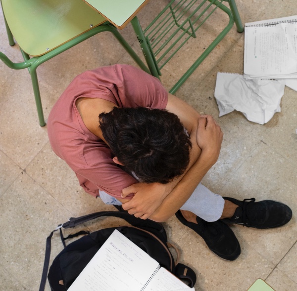 young male student showing signs of social isolation