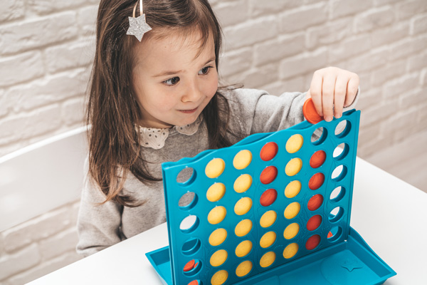 girl playing a boardgame