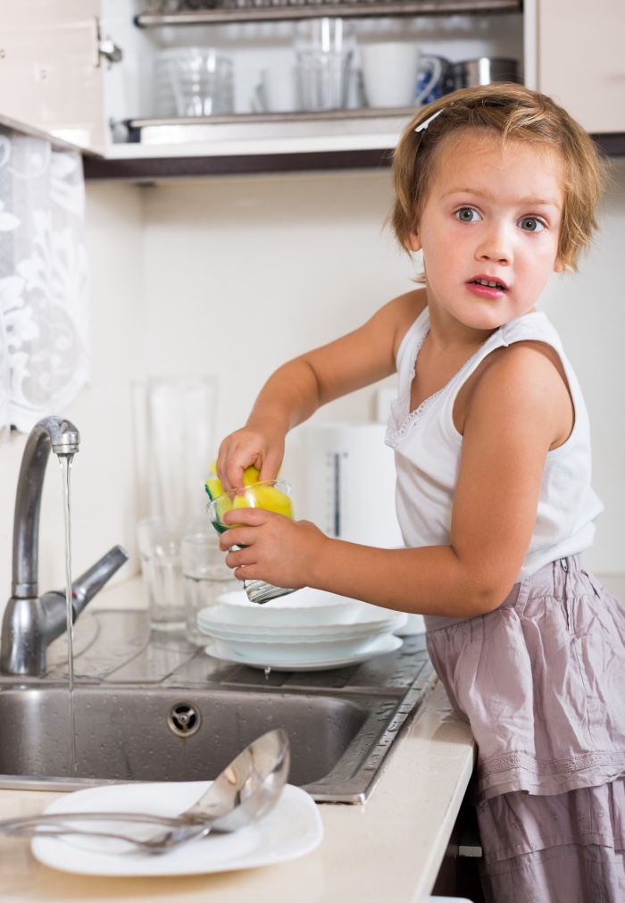 child independently washing up