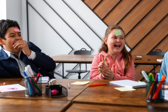 children laughing in the classroom disruptive behaviour