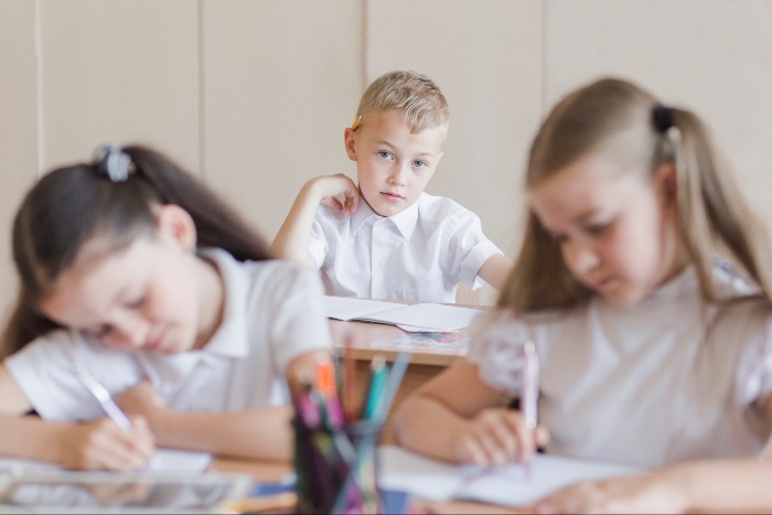 boy looking at his classmates
